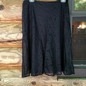 Gorgeous black skirt, patterned, lace overlay.